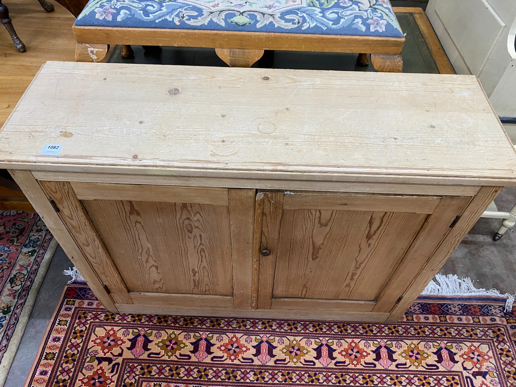 An Edwardian pine cupboard, width 126cm height 94cm